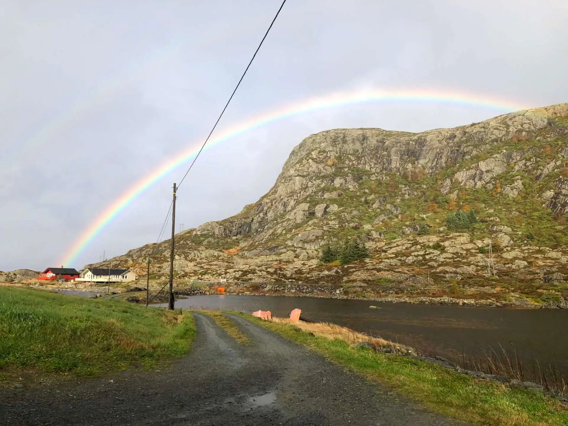 Rainbow over the rocky landscape at Stavenes